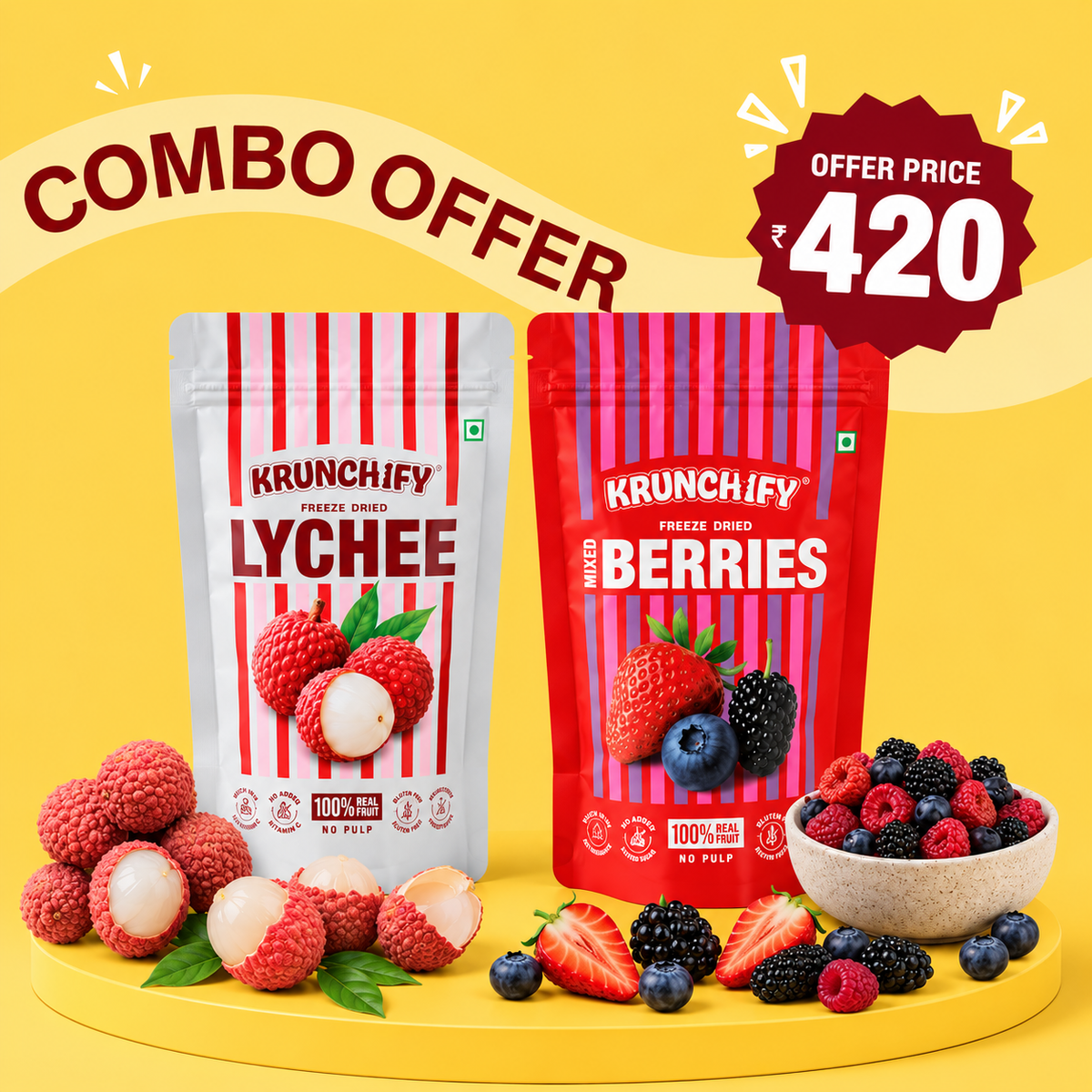 Two stand-up pouches of Krunchify freeze dried fruit snacks on a yellow background: Lychee and Mixed Berries. Fresh lychees, strawberries, blueberries, blackberries, and raspberries are arranged around the products, with a large 'COMBO OFFER' banner and a red 'Offer Price 420' badge.